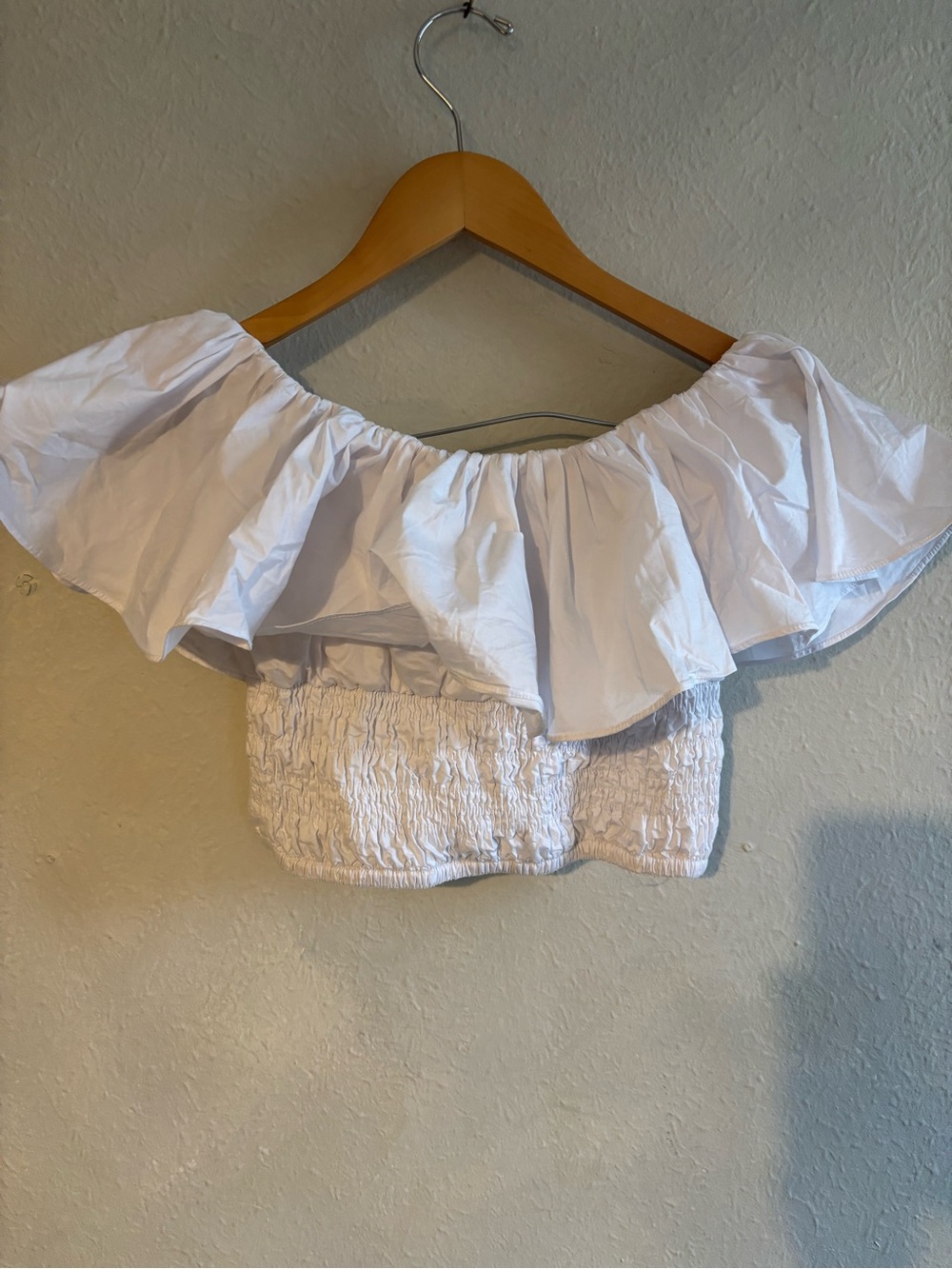 Olivaceous White Off-Shoulder Ruffle Smocked Crop Top